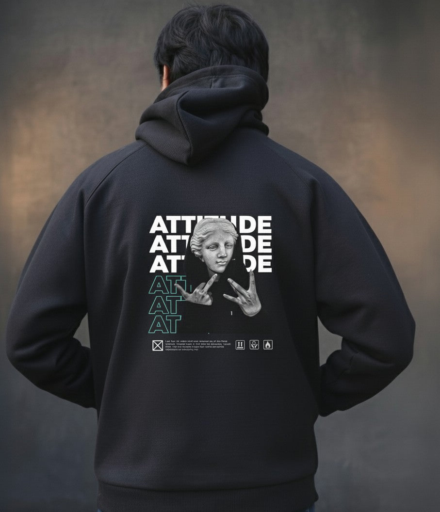 Person wearing a black hoodie with graphic design on the back against a dark background
